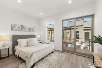 Photos of Model Home. Expansive primary suite with space for a king bed, lounge chair, and personal touches, offering a private sanctuary above the city.