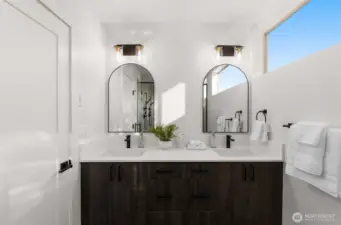 Photos of Model Home. Sophisticated secondary bath featuring double vanities, quartz countertops, and stylish fixtures that make daily routines a pleasure.