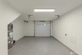Photos of Model Home. Spacious garage with room for parking and storage, thoughtfully designed and EV-ready for modern convenience.