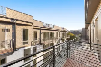 Bedroom balcony perspective shows generous square footage, perfect for a morning coffee.