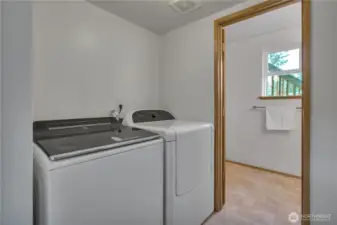 Laundry room with newer washer and dryer.