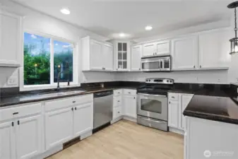 Kitchen with Fresh White Cabinets & Granite Countertops