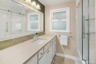 Main level full bathroom, with ample storage
