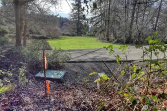 From Lot 6 looking down meadow toward the water.  Any home built here likely 25 feet or higher with more  filtered water views