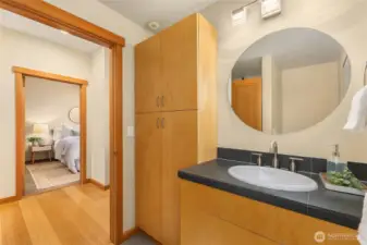 Main floor bathroom has plenty of storage.