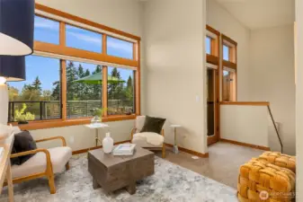 The second story greats you with an open den/home office show casing large windows and vaulted ceiling.