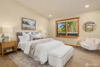 The primary suite is on the upper level and features an en-suite full bath and walk-in closet.