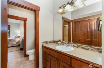 "Jack & Jill" Bathroom Serves the Two Secondary Bedrooms~Separate Vanities & Closets~Shared Toilet & Shower~