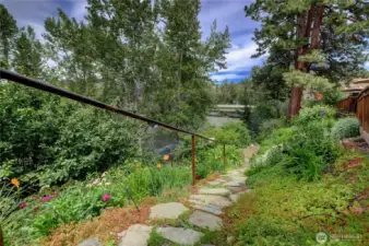 Safety rail lines the gently sloped stone walkway to Twisp River.
