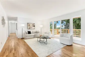 Stunning refinished hardwoods throughout the main floor, including in the beautiful living room! The bedrooms and main floor bath are down the hallway. Deck and backyard access out the sliding door.