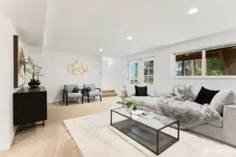 This is the large downstairs rec room. It is a perfect place to watch a movie or have a game night!