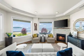 Your living area has a cozy gas fireplace, full height surround and live edge mantle. Coffered ceilings and crown molding add a lovely finish touch.