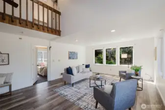 View of Living room with a peak a boo of Primary bedroom