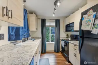 Galley kitchen with lots of natural light on main