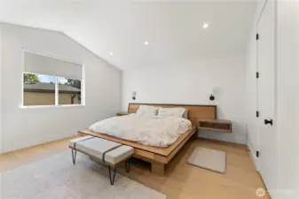 Spacious primary suite bedroom. Walk-in closet to the right.