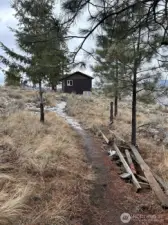 Separate studio with propane heater and small wood stove.