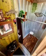 Shower area that is connected to a grey water septic container.