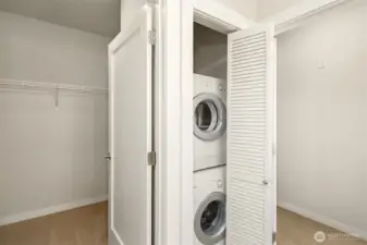 Washer dryer in primary bath.