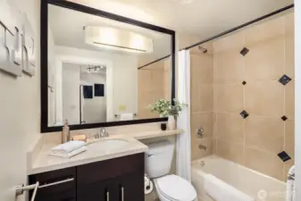 The guest bath is also fresh and welcoming!