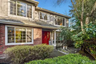 Surrounded by mature landscaping, this meticulously maintained home welcomes you