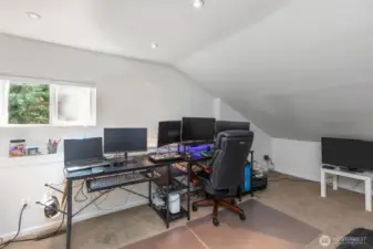 This separate bedroom is up the stairs in the staircase... a private oasis away from the hustle and bustle of the rest of the house. Currently used as an office. Check out the custom work under the windowsill.