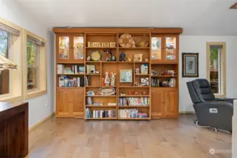 Bookcase in addition slides open to reveal Murphy bed
