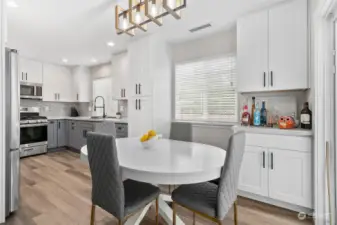 This kitchen is simply beautiful!  It has all new cabinets, pantry, bar and gorgeous Calcutta Creek Quartz counters. The stunning subway tile backsplash is perfectly complemented by undermount lighting and adds a touch of sophistication to this fantastic kitchen.
