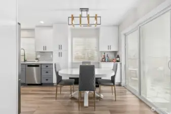 Relax and entertain in style in the inviting dining area, enhanced by on-trend lighting, offering a seamless transition to the living room and expansive 600 Sq Ft out side patio.