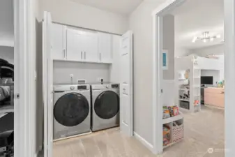 Upstairs and conveniently located next to the bedrooms is the laundry space with new cabinets and the washer and dryer are included.