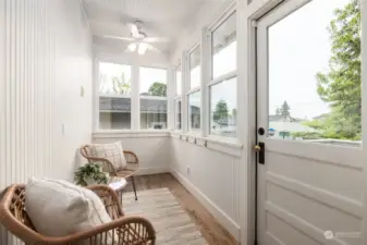Sunroom with door to back porch