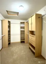 Master walk in closet with custom cabinets