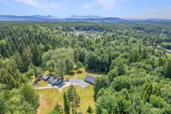 A slice of paradise nestled in Snohomish, encompassing 16.86 acres of lush greenery with a renovated rambler.