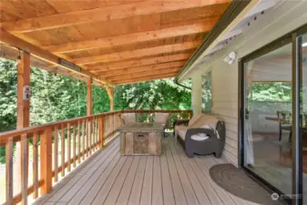 The fully covered deck, accessible from the great room, provides a spacious and sheltered outdoor area, perfect for relaxing and entertaining in any weather.