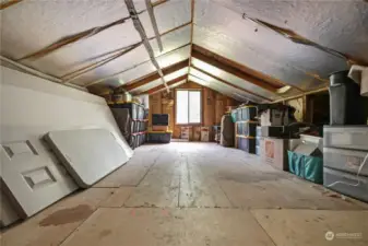 The attic space boasts unlimited potential, awaiting transformation into a versatile area for storage, a cozy retreat, or even additional living space.