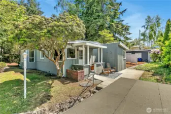 Looking from the top of the garage you'll find an entrance to the house or keep walking toward the back of the lot and you'll find a 500 sqft cottage.
