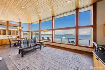 Looking out across the open living space towards the dining area with built-in butler's cabinets.