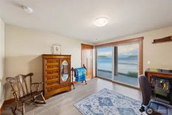 Second lower level bedroom with incredible views and access to the covered lower level space.