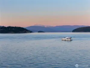 Sunset views of Mount Baker beyond the sparkling Salish Seas.