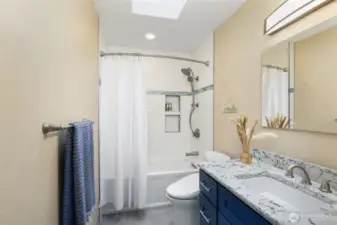 2nd home new bathroom...quartz counter, tiled shower/floor and skylight!