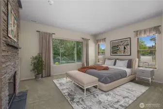 Primary bedroom and bathroom with gas fireplace, large closet and full tile shower.