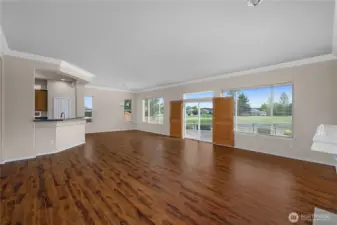 Large Great Room with engineered hardwood floors and gas fireplace.
