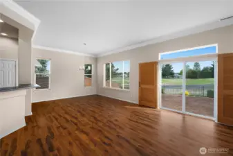 Large Great Room with engineered hardwood floors and gas fireplace.