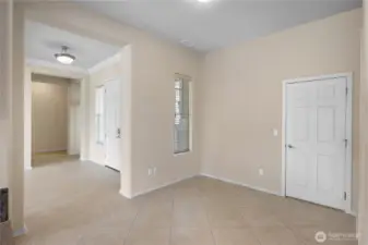 Flex sitting/dining space off kitchen that leads into laundry room.
