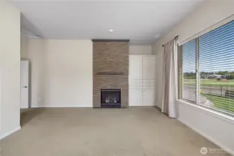 Primary bedroom and bathroom with gas fireplace, large closet and full tile shower.