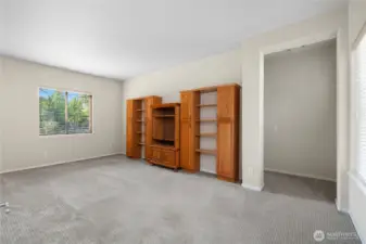 Bright and light bonus room that leads to 2nd bedroom, flex room, and full bathroom.