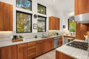The kitchen is graced with cherry cabinets with under cabinet lighting.