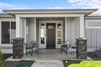 Welcoming front porch! Also provides a cool  respite from afternoon sun in late  summertime.