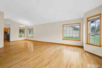 View from the living room toward the dining area with direct access into the kitchen.