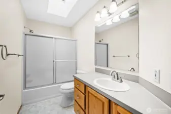 Full bathroom with tub/shower combination.