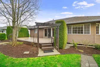 Large deck with pergola and direct access to home, perfect for outdoor entertaining.